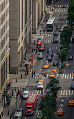 Bird's eye view of people and traffic in Midtown Manhattan busy streets at an intersection on Park...