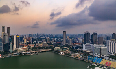 View of the bay and city skyline with skyscrapers at sunrise in Singapore
