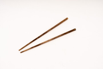 wooden chopsticks on white background