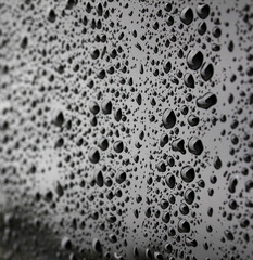 water drop on car in the after rain . water drop on black background . 