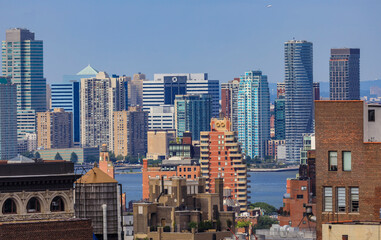 Fototapeta premium Aerial view of the iconic skyline in Midtown Manhattan, New York and across Hudson River in Jersey City, USA