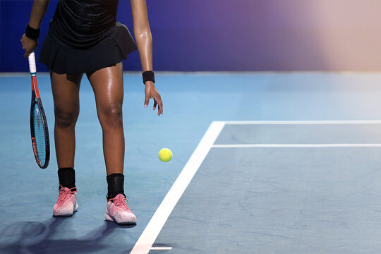 female tennis player with racket and ball