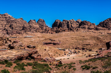 It's Canyon in Petra (Rose City), Jordan. The city of Petra was lost for over 1000 years. Now one of the Seven Wonders of the Word