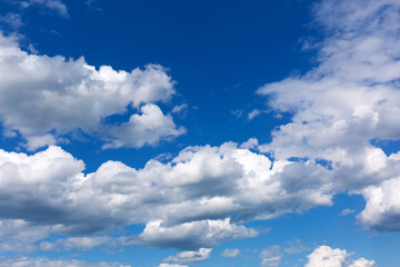 Naklejka na ściany i meble Blue sky background with white clouds.