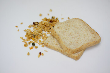 Howe bread with dried cereals on a white background