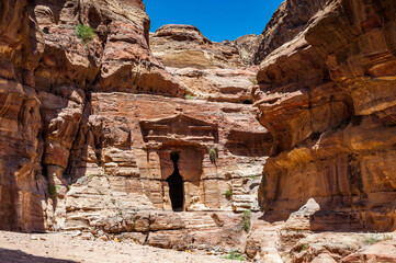 It's Lion Triclinium in Petra (Rose City), Jordan. The city of Petra was lost for over 1000 years. Now one of the Seven Wonders of the Word