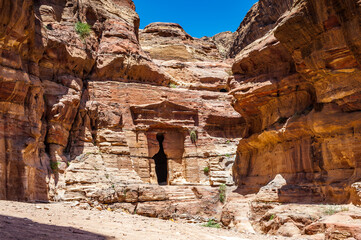It's Lion Triclinium in Petra (Rose City), Jordan. The city of Petra was lost for over 1000 years. Now one of the Seven Wonders of the Word