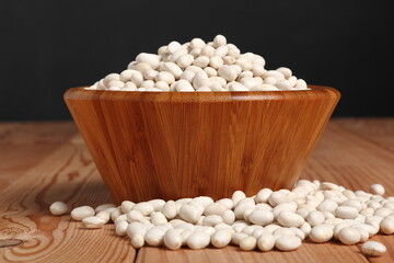 Navy beans in wooden bowl
