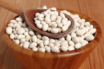 Navy beans in wooden bowl