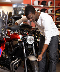 Adult Afro American man choosing new bike