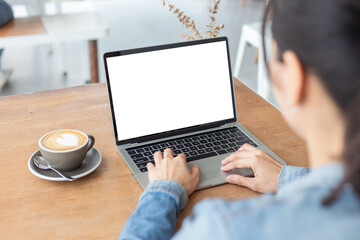 computer mockup image blank screen.hand woman work using laptop with white background for advertising,contact business search information on desk at coffee shop.marketing and creative design