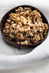 A walnut is the nut of any tree of the genus Juglans, particularly the Persian or English walnut, Juglans regia. A walnut is the edible seed of a drupe, and thus not a true botanical nut.