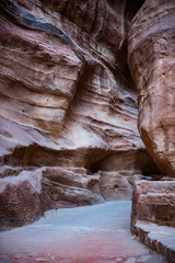 It's Canyon in Petra (Red Rose City). The city of Petra was lost for over 1000 years. Now one of the Seven Wonders of the Word