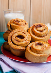 Vertical shot of delicious homemade cinnamon rolls for holidays made with sugar,salt, butter, eggs, flour, milk and cardamom. 