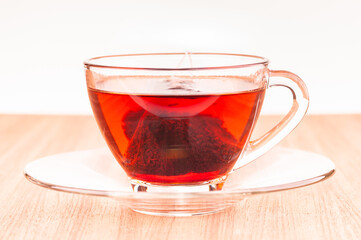 Pyramid mesh teabag in a glass cup