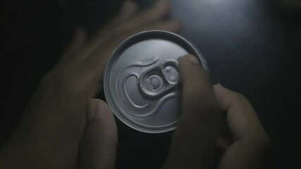 Dark skinned hand opening a can of soda handheld in slow motion - Powered by Adobe