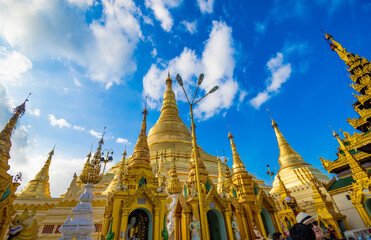 Buddhist Pilgrims in the Shwedagon Pagoda at night. It is the most sacred Buddhist pagoda for the...