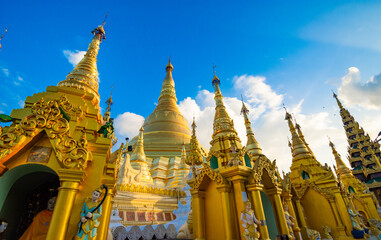 Buddhist Pilgrims in the Shwedagon Pagoda at night. It is the most sacred Buddhist pagoda for the...
