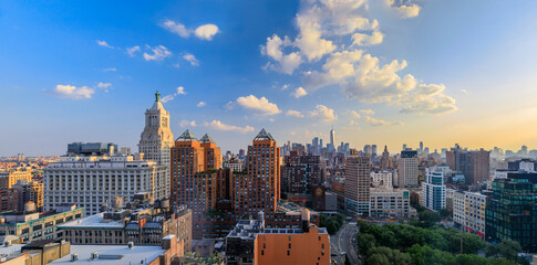 Aerial view of the iconic skyline and skyscrapers of New York Lower Manhattan on a cloudy day before sunset