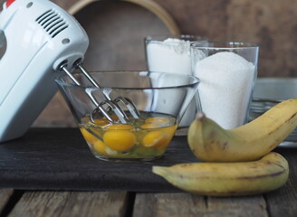Confectionery background. Stage of cooking biscuit with banana. Cooking a pie of three ingredients.