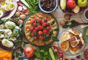 Soft focus or blurry focus.Photo above.A lot of wholesome vegetarian food on the table, ready to receive guests. Healthy homemade food.