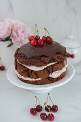 black forest chocolate cake with cherry pie filling with dark chocolate glaze