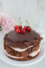 black forest chocolate cake with cherry pie filling with dark chocolate glaze