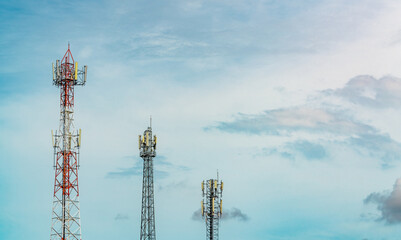 Telecommunication tower with blue sky and white clouds. Antenna on blue sky. Radio and satellite...