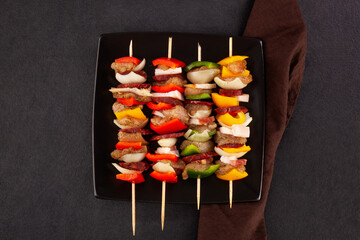 Chicken skewers with vegetables and spices. Top view.