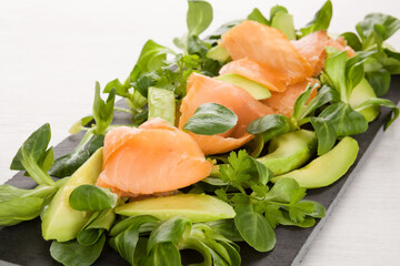 Salmon, avocado and salad.