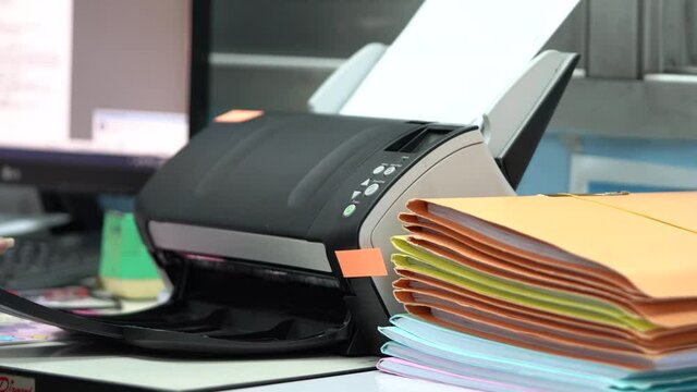 Using scanner machine for convert document to digital data storing into computer in office, to reduce usage and reuse paper.