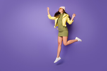 Fototapeta na wymiar Full length body size view of her she nice attractive pretty dreamy cheerful girl jumping walking enjoying free time isolated over bright vivid shine vibrant lilac purple violet color background