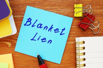 Financial concept about Blanket Lien with inscription on the sheet.