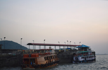 House boats parked in a bay of mumbai, near Elephanta caves.