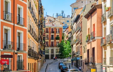 Tuinposter Beautiful traditional residential buildings with metal balconies in the streets of the city center in Madrid, Spain © SvetlanaSF