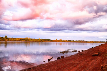 Beautiful summer landscape with river, bright blue sky and dramatic clouds
