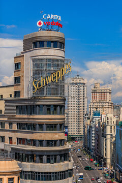Madrid, Spain - June 4, 2017: Aerial view of the iconic Edificio Carrion or Capitol building with Schweppes advertisement on Gran Via shopping street