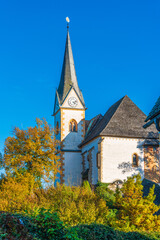 Magical Gothic architecture in Austria. Panorama on Lake Worthersee. Maria Worth church and sanctuary.