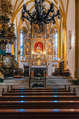 Obraz premium Magical Gothic architecture in Austria. Panorama on Lake Worthersee. Maria Worth church and sanctuary.