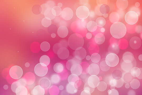A festive abstract orange pink red gradient background texture with glitter defocused sparkle bokeh circles. Card concept for Happy New Year, party invitation, valentine or other holidays.