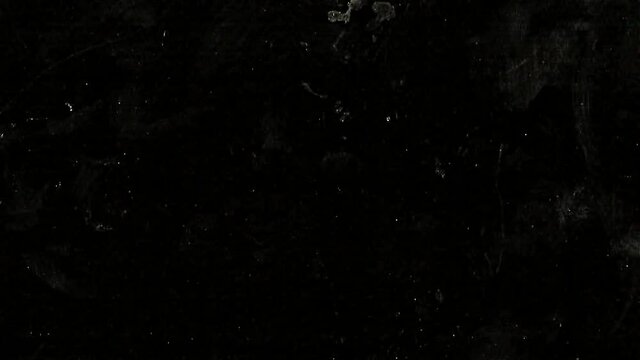 Closeup of black-white old grunge overlay particles texture background, monochrome vintage effect with noise, scratch, dust