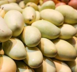 Mango on the counter in the market .