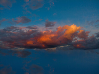 Dark cloudy sky background over the sunset in the evening summer sky