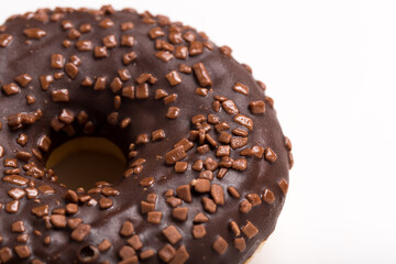 Chocolate donut on a white background close-up.