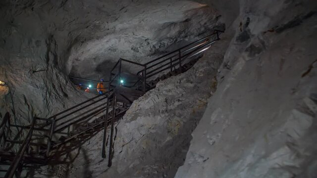 Miners listening to the instructions of their engineer at the underground mining site.