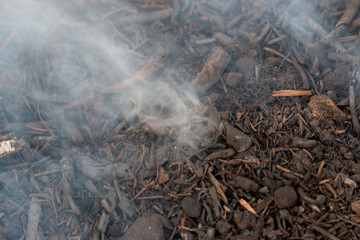 gray smoke on coals as a background