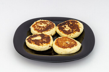 homemade cheesecakes on a black plate