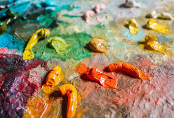 Colorful palette with oil paints textured, close up