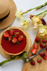 Cold cheesecake with strawberry jelly.