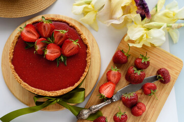 Cold cheesecake with strawberry jelly.